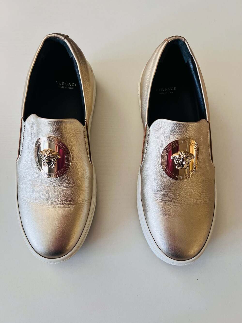 Versace Nappa Laminata Medusa Slip-On Sneakers in Gold Leather